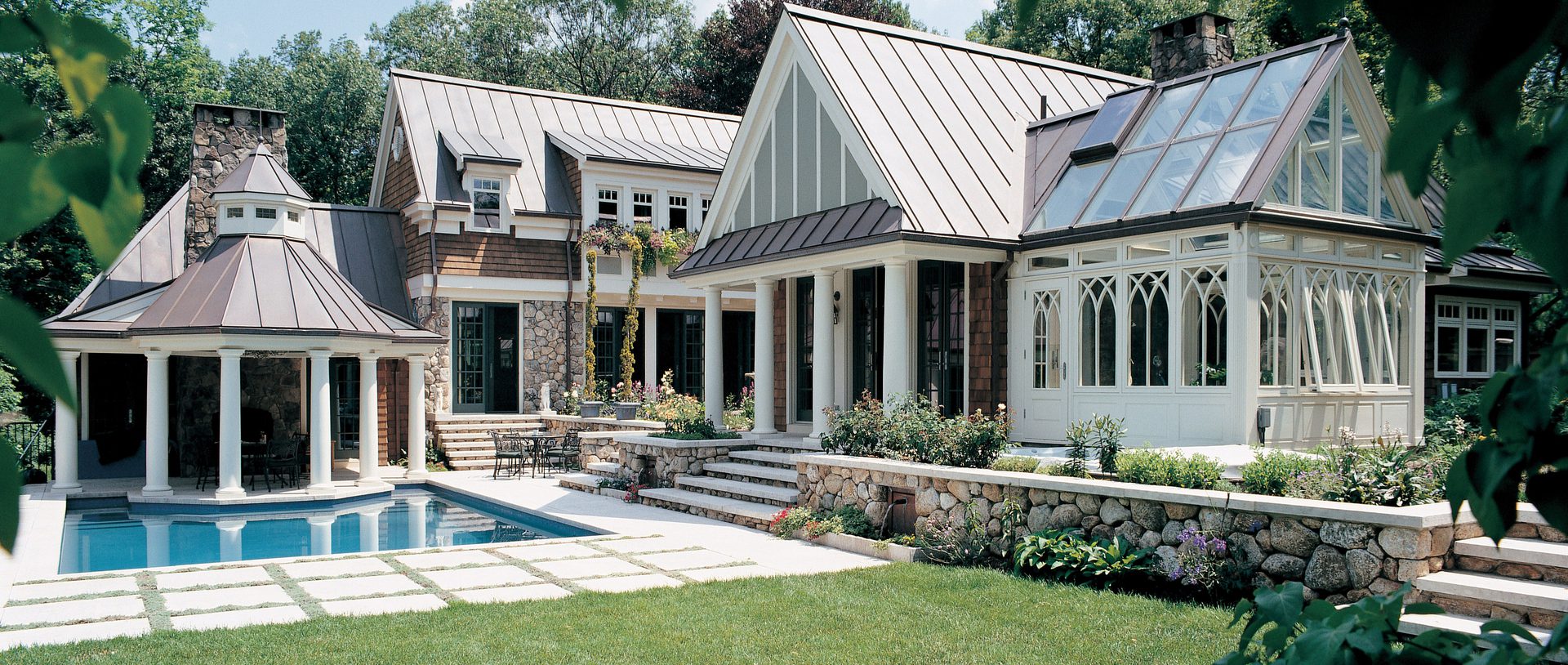 A large house with a pool and patio area.