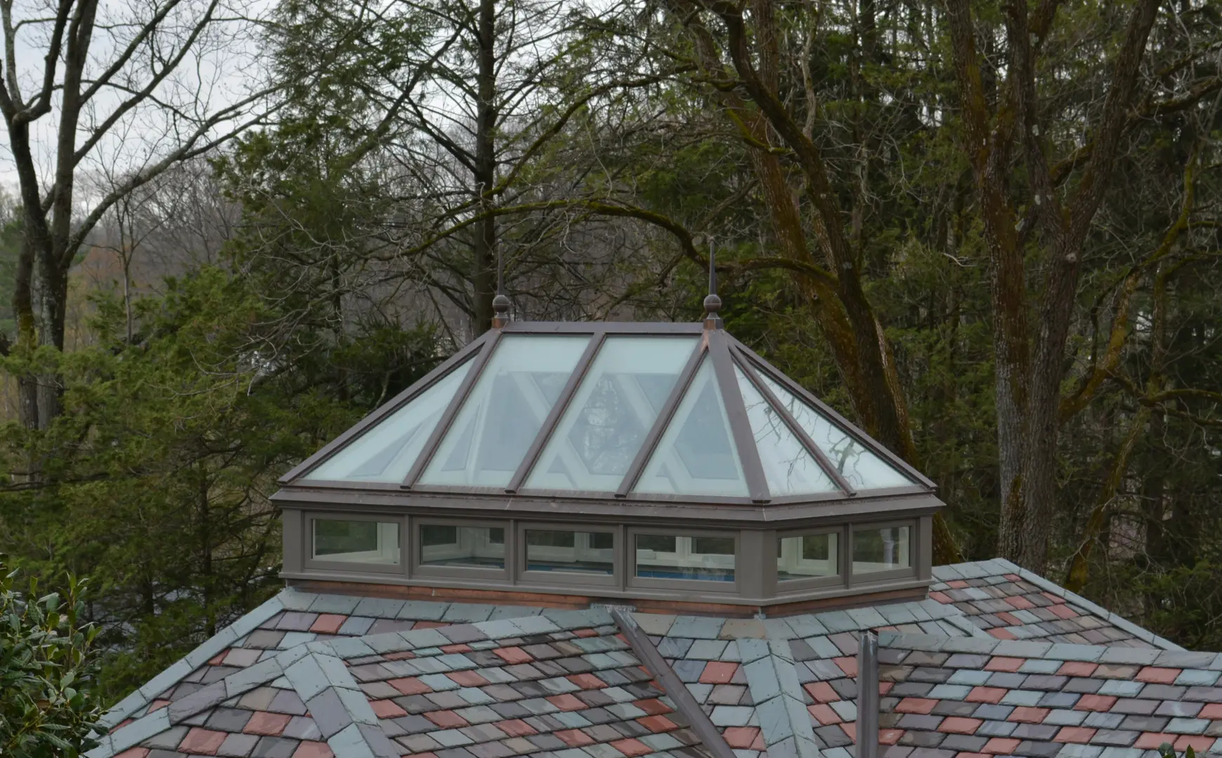A roof with a glass dome on top of it.