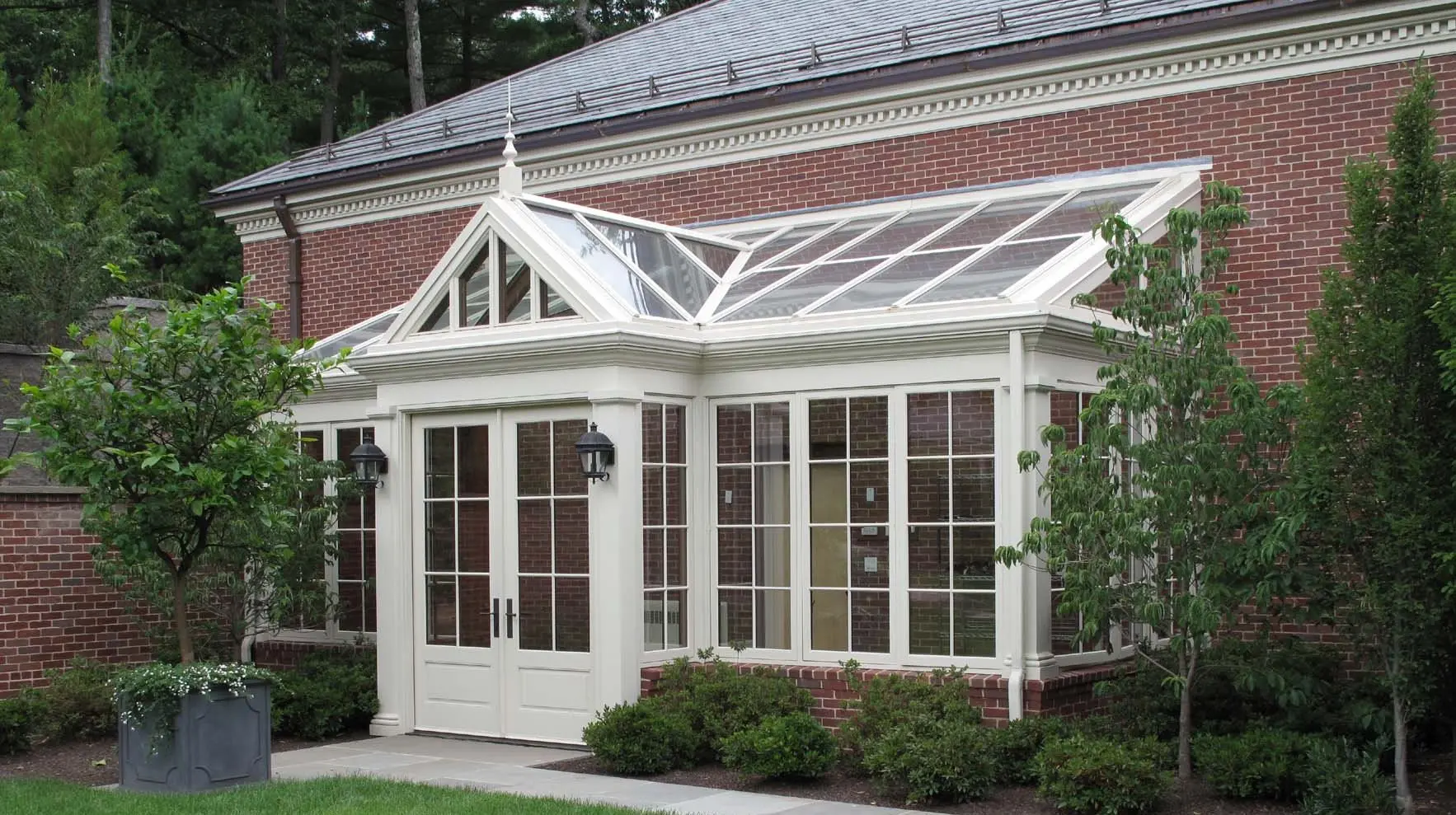 A white building with a large glass roof.