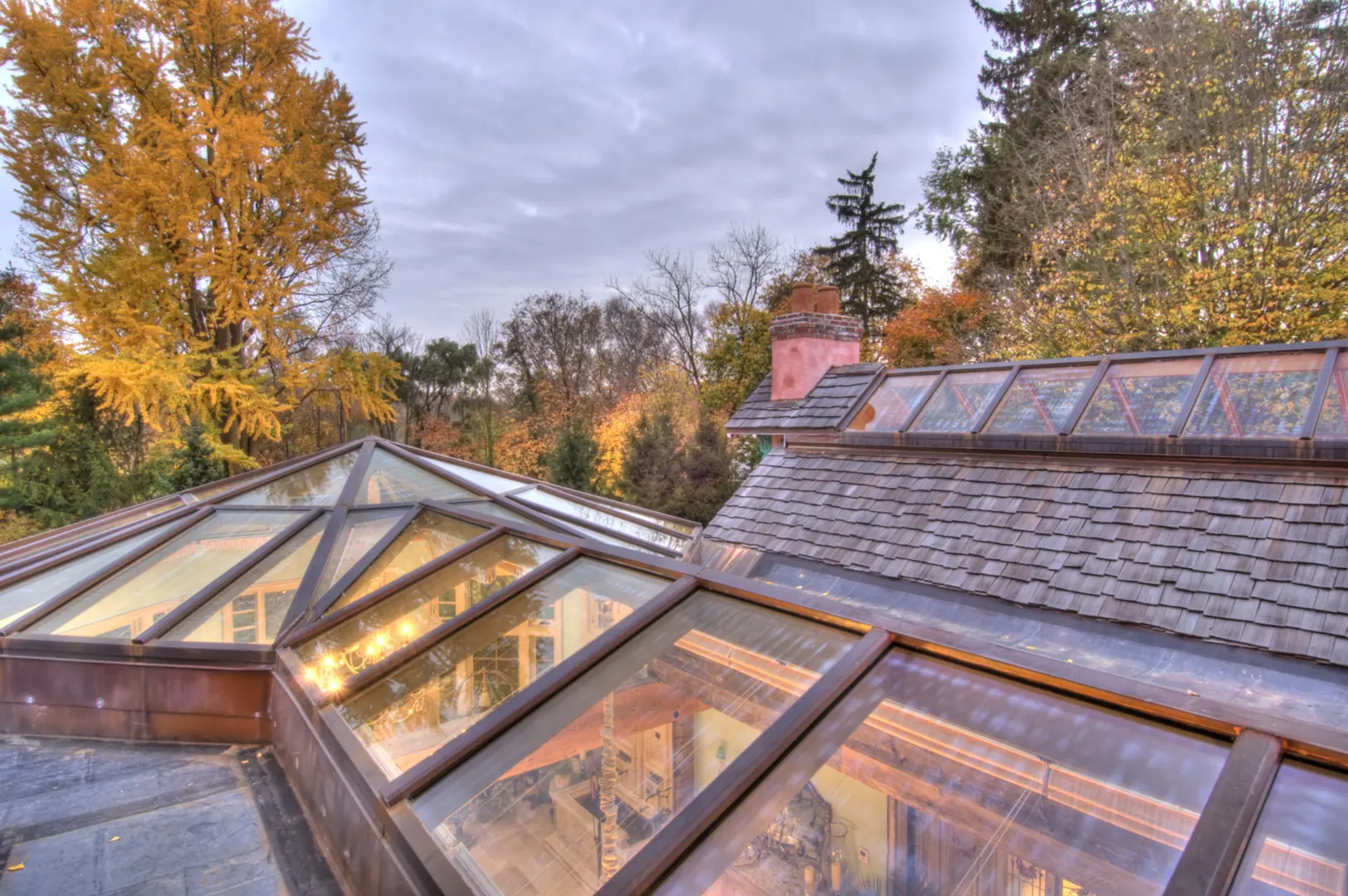 A roof with glass windows and a wooden frame.