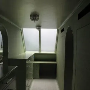 A room with a window and a sink