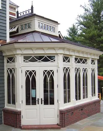 A building with two doors and a large window.