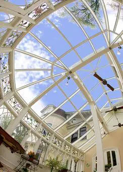 A view of the inside of a building with a sky background