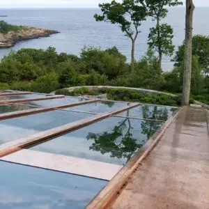 A view of the ocean from above a pool.
