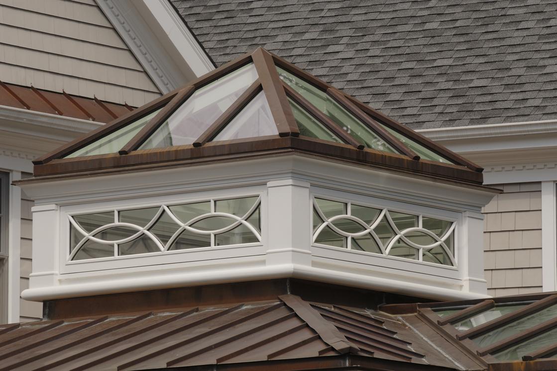 A close up of the corner window on a roof