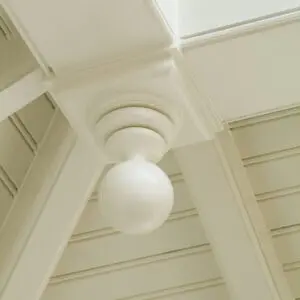 A ceiling light fixture hanging from the rafters.