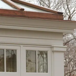 A close up of the window and roof on a house