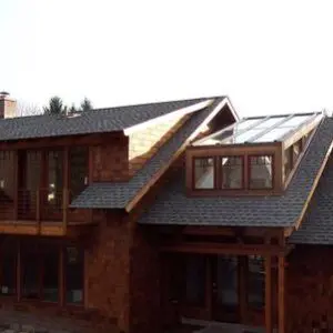 A large house with a lot of windows and roof