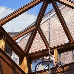 A large wooden structure with a metal chain hanging from it.