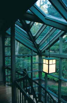 A view of the inside of a house with glass windows.