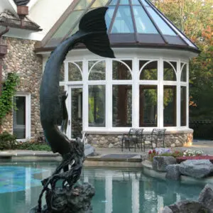 A statue of a dolphin in the shape of a fish.