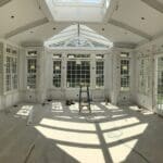 A room with many windows and doors in it