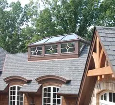 A house with a roof that has windows on it.