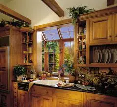 A kitchen with wooden cabinets and a sink.