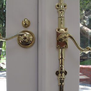 A door handle with two different locks on it.