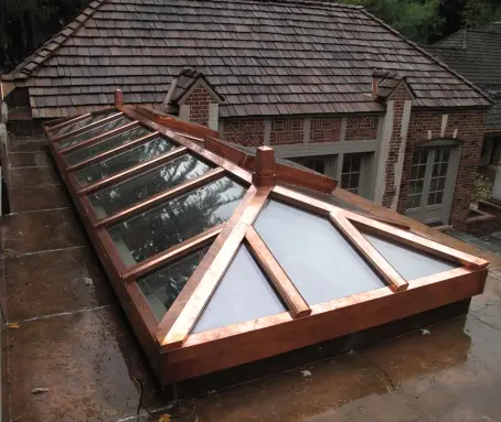 A large roof with a skylight on top of it.