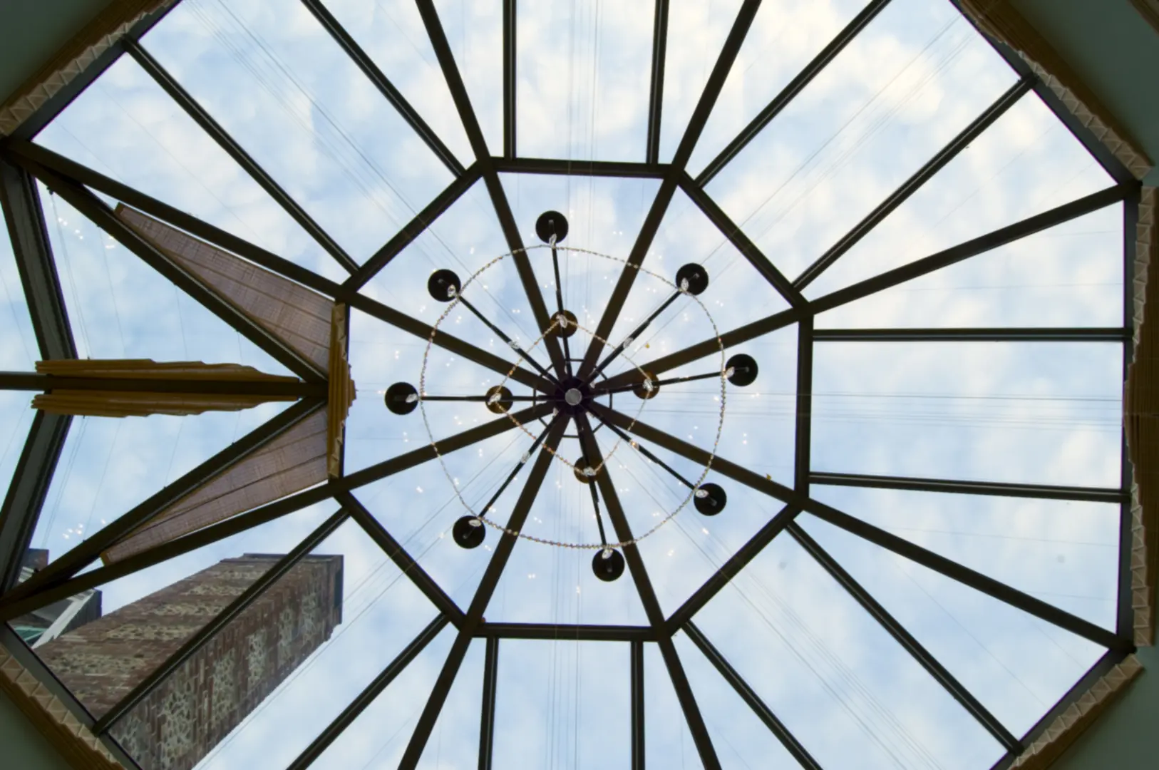 A view of the top of a building from below.