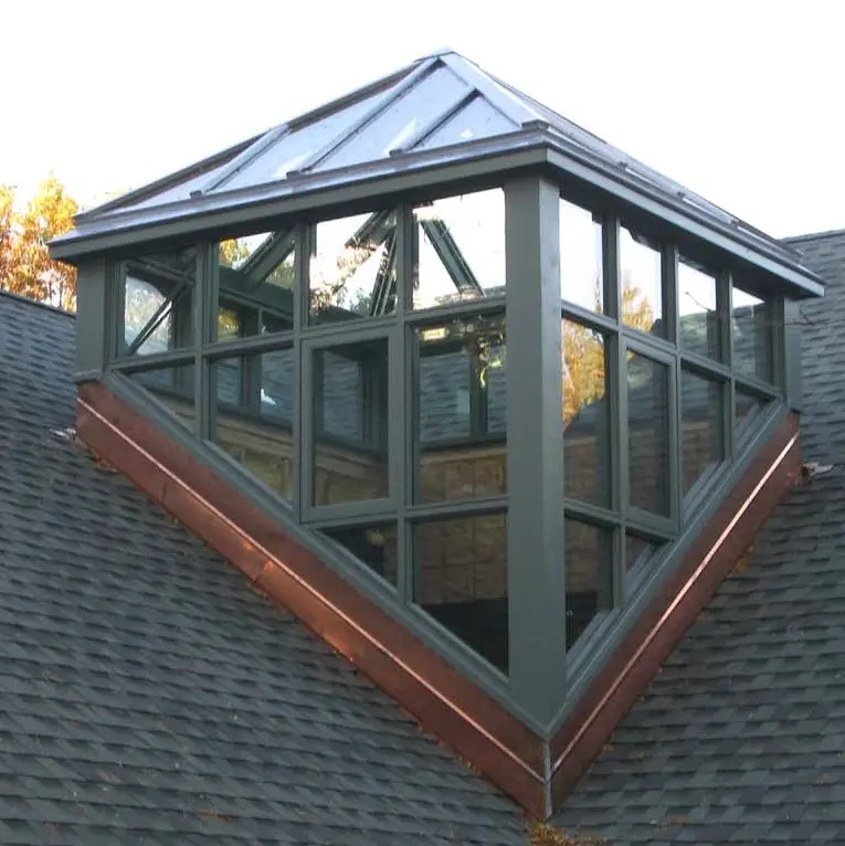 A roof with a window that is shaped like a triangle.