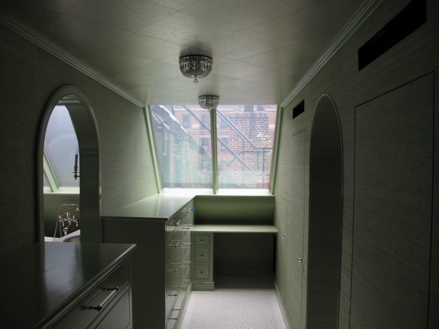 A view of the inside of a room with a window.