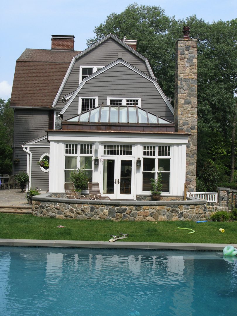 A large house with a pool in the yard