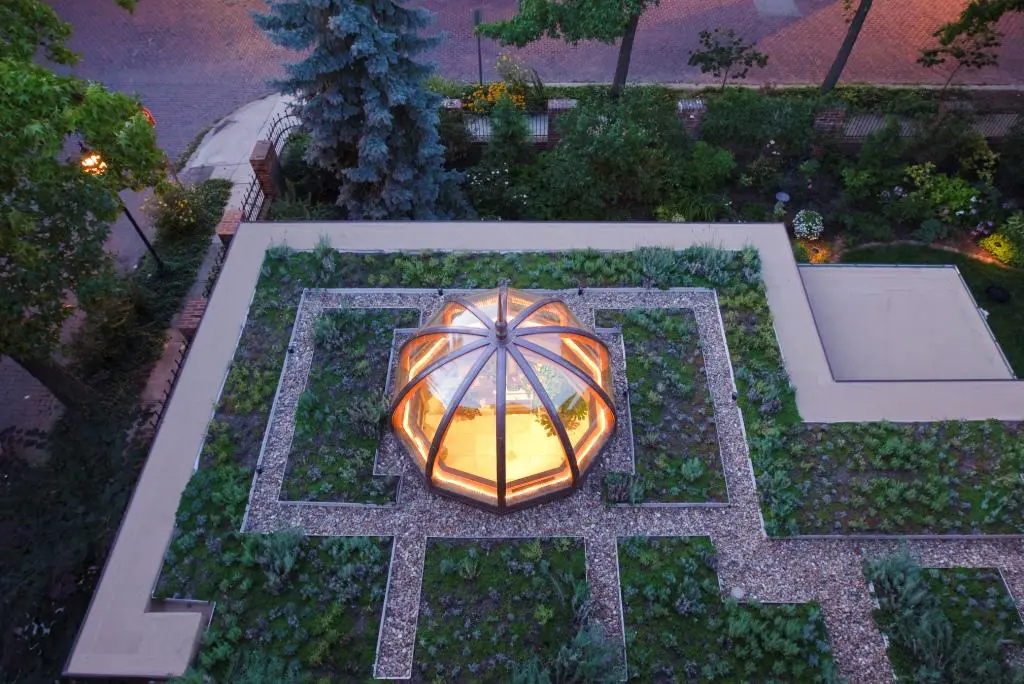 A garden with a light in the center of it.
