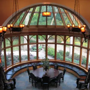 A round table in the center of an indoor room.