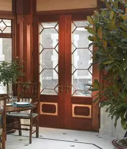 A room with two doors and chairs in it
