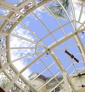 A view of the sky through an open roof.