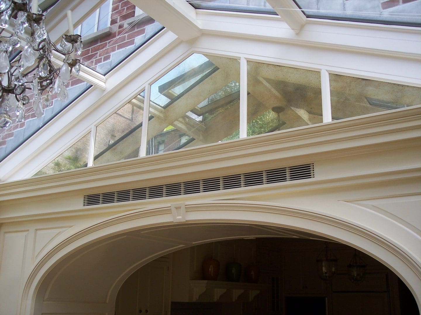 A large open ceiling with skylights and arches.