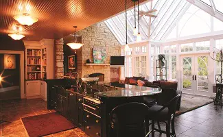 A kitchen with a stove and a fireplace.